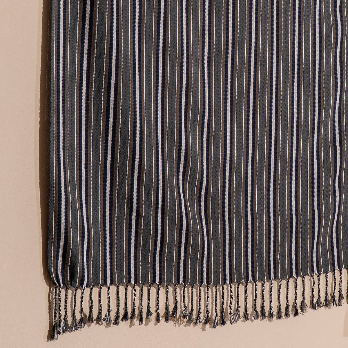 Fringed hem of the graphite pinstripe Turkish peshtemal | Kikoya