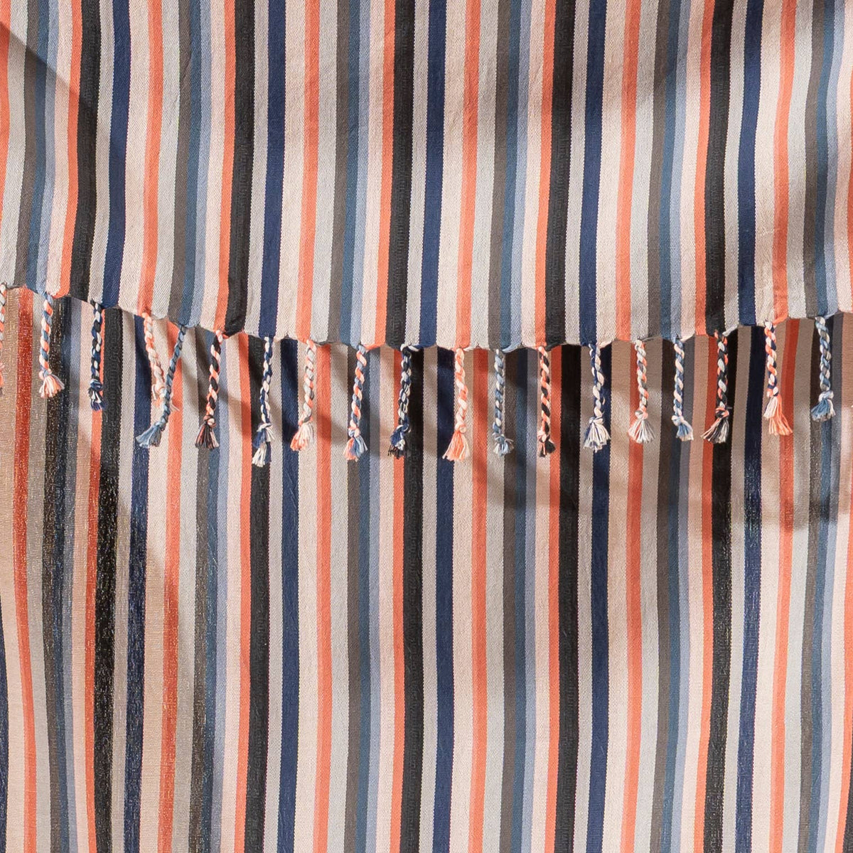 Close-up of the rustic flat weave and terracotta stripes on cream cotton | Kikoya
