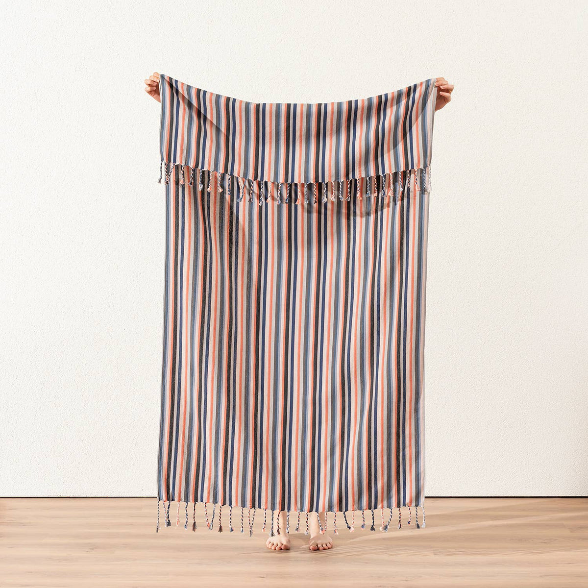Terracotta and blue stripe Turkish peshtemal held open, 40x70 in | Kikoya