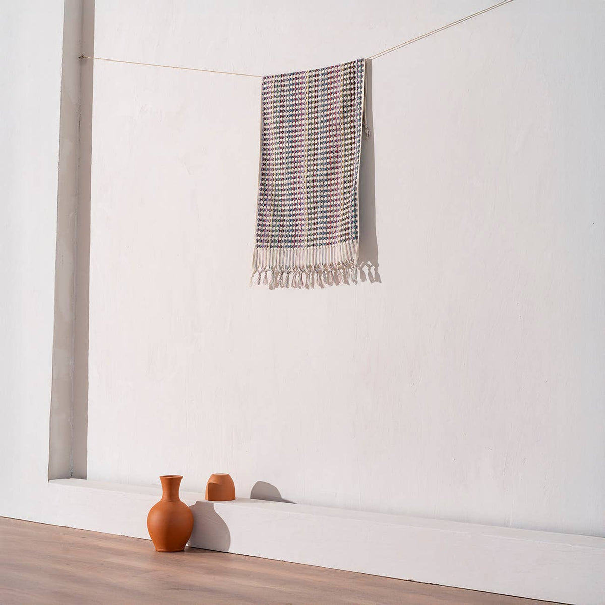 Handloomed Turkish hand towel with multicolour pompoms, 17x38 in | Kikoya