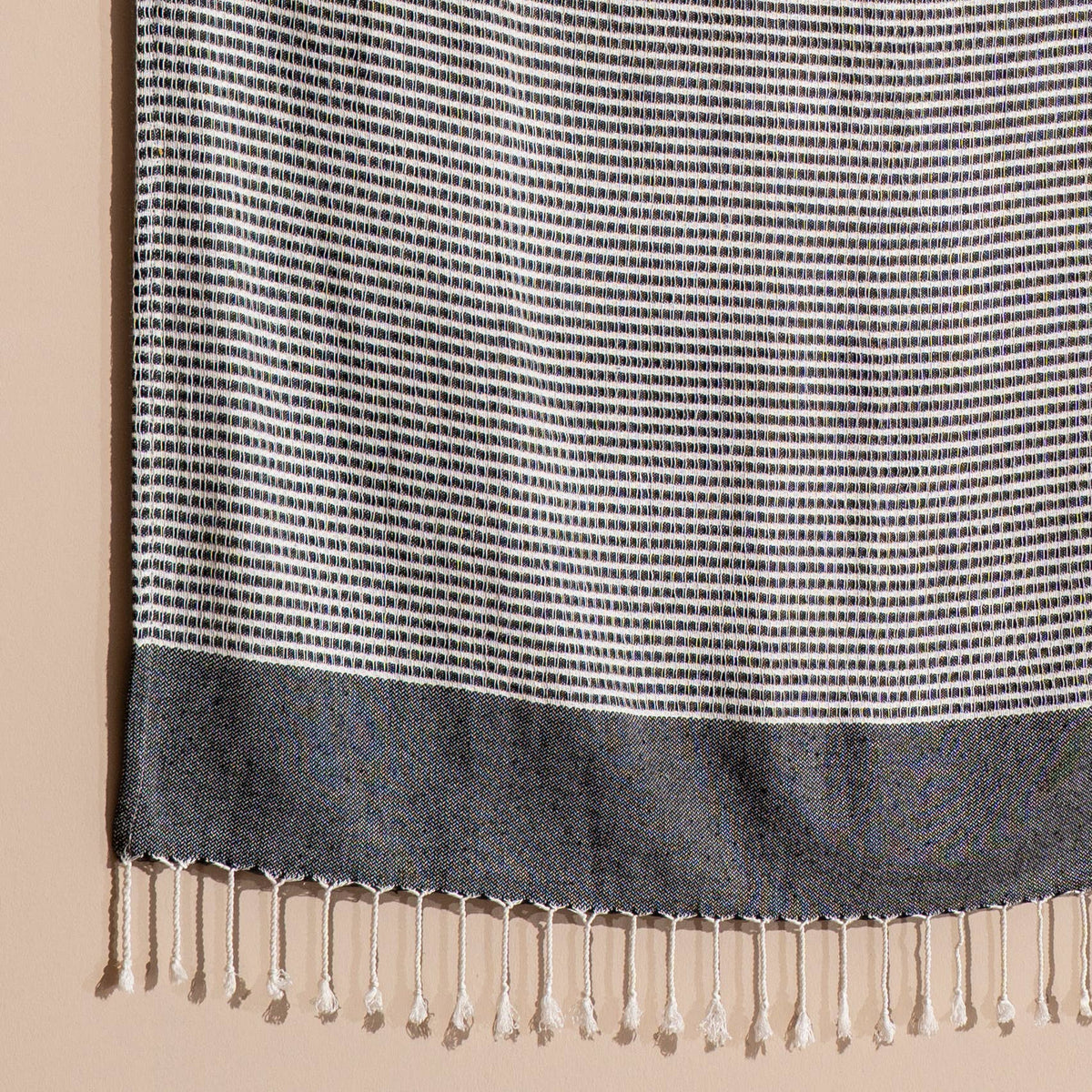 Close-up of the black fine stripe weave and solid end band | Kikoya