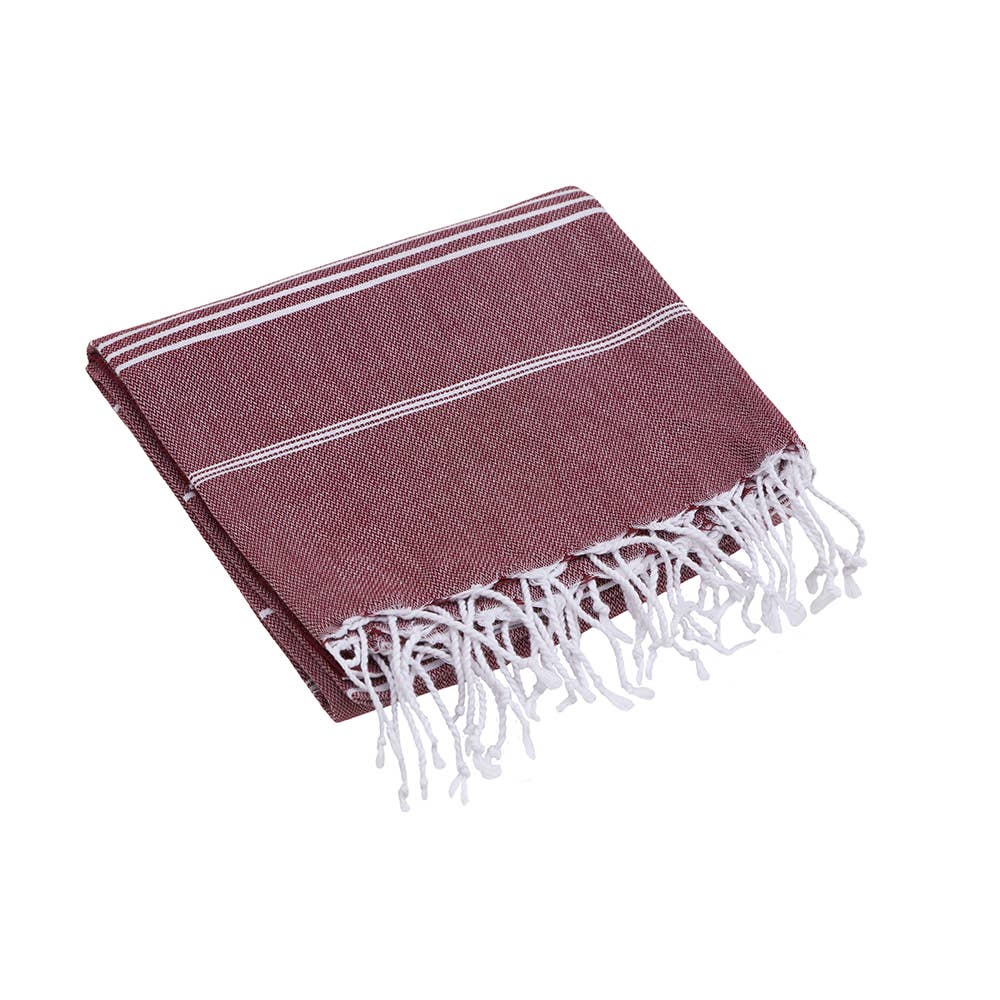 Sultan Turkish beach towel – Burgundy, folded with knotted fringe | Kikoya