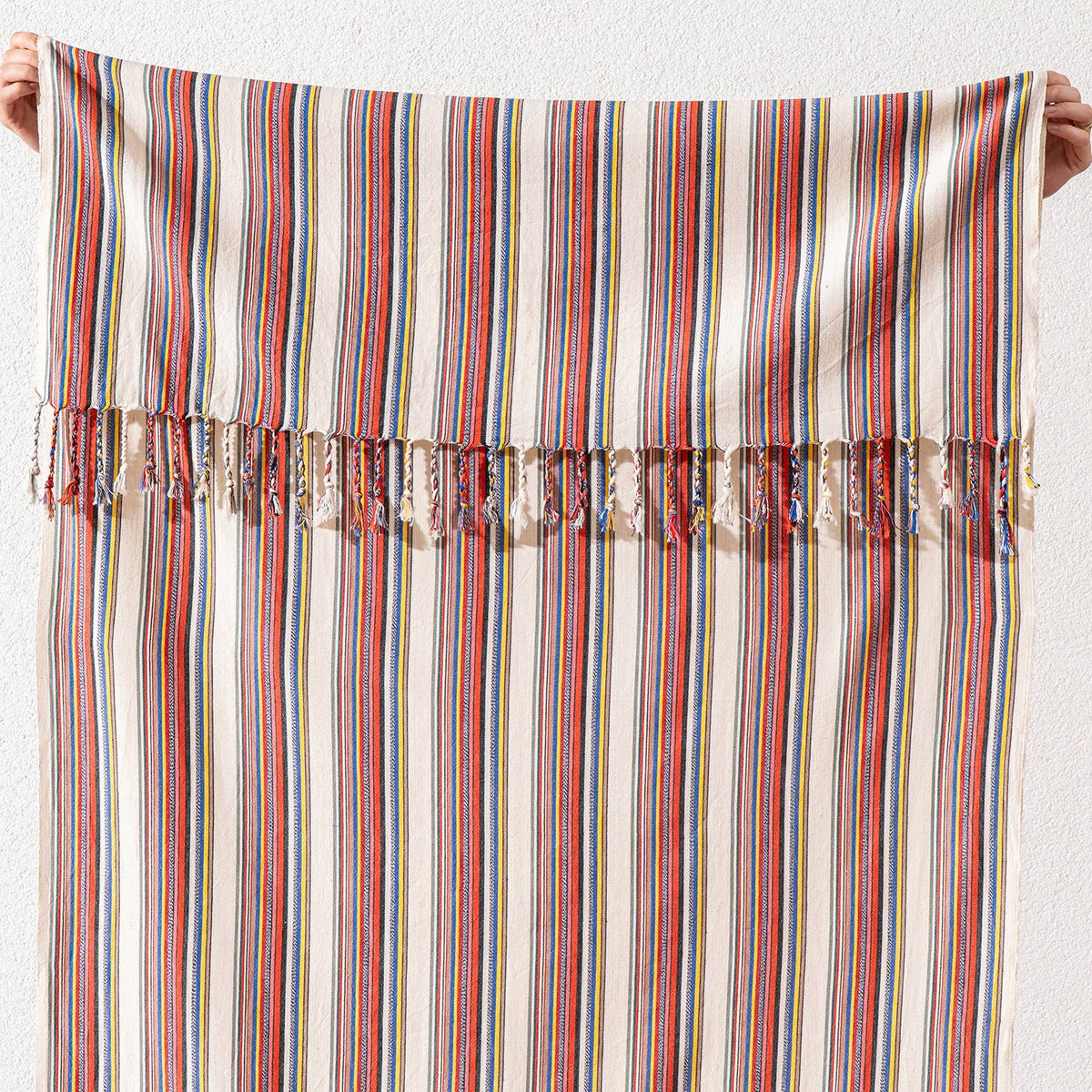 Hand-knotted fringe detail on the bazaar stripe Turkish towel | Kikoya