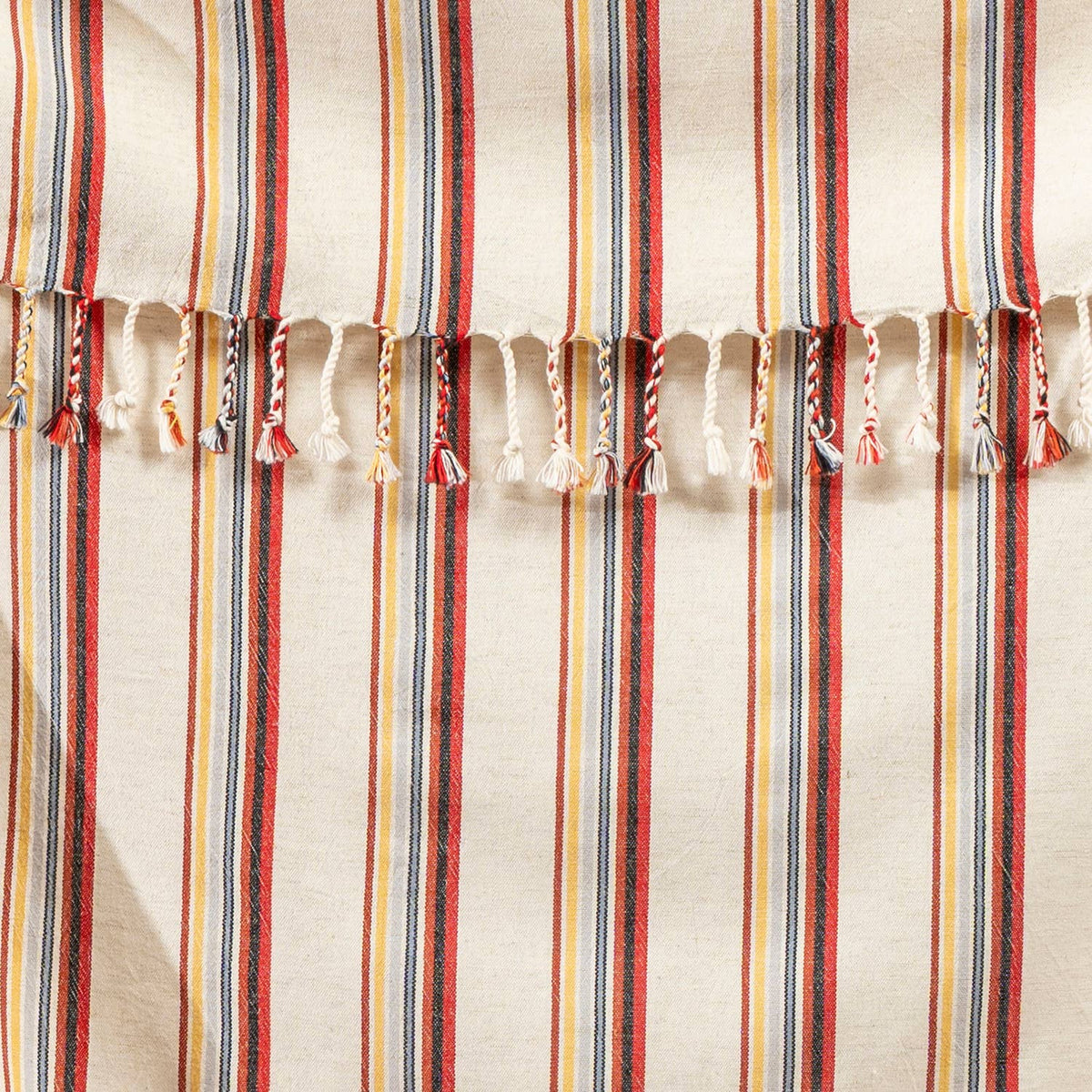 Hand-knotted fringe and red, mustard and blue pinstripes on the linen-look Turkish towel | Kikoya