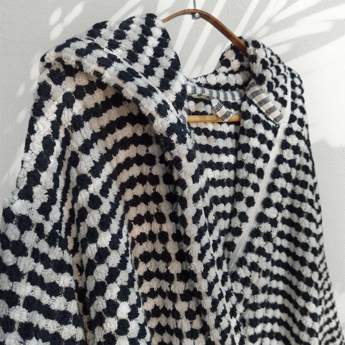 Pompom Turkish bathrobe – Black & White, Hooded, lifestyle view | Kikoya