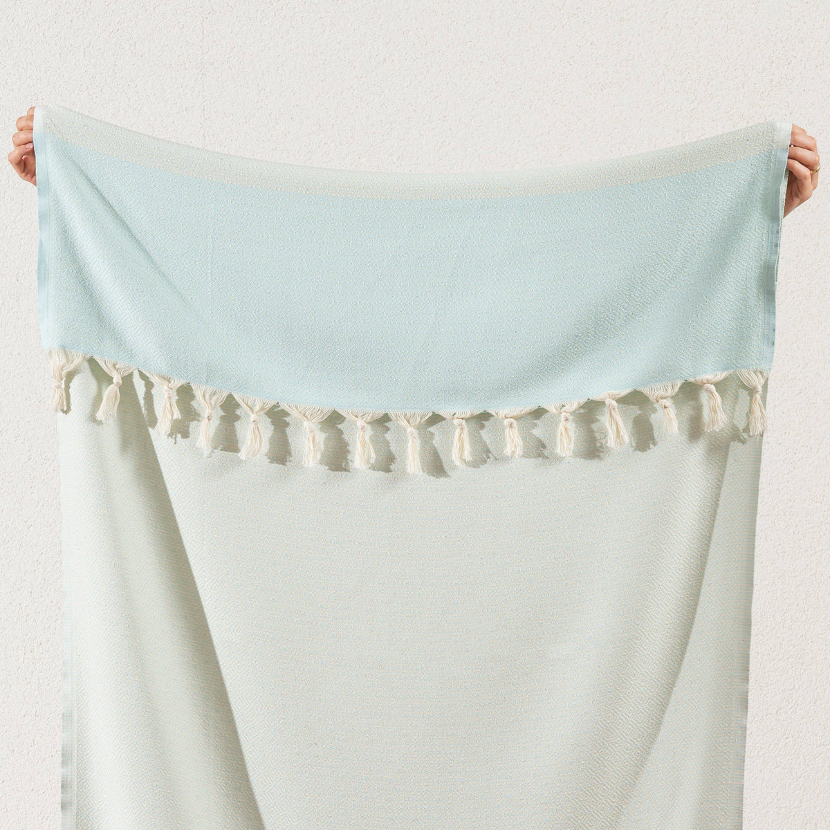 Green Topkapi diamond weave Turkish towel showing the tasselled fringe up close | Kikoya