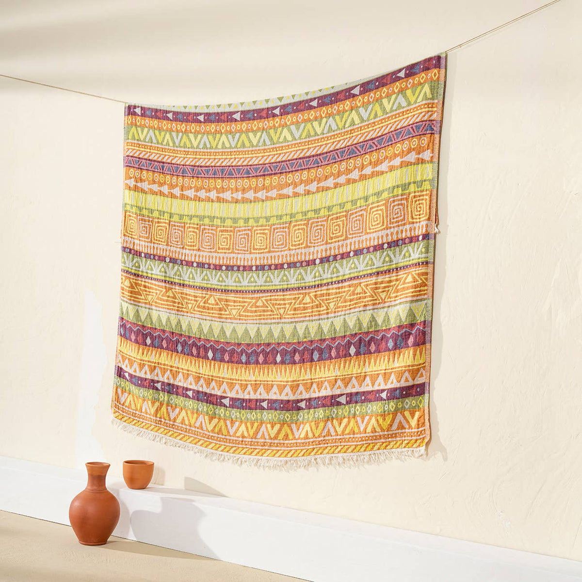 Ethnic Turkish cotton throw blanket – tribal stripe, Yellow & Green, styled on a wall | Kikoya