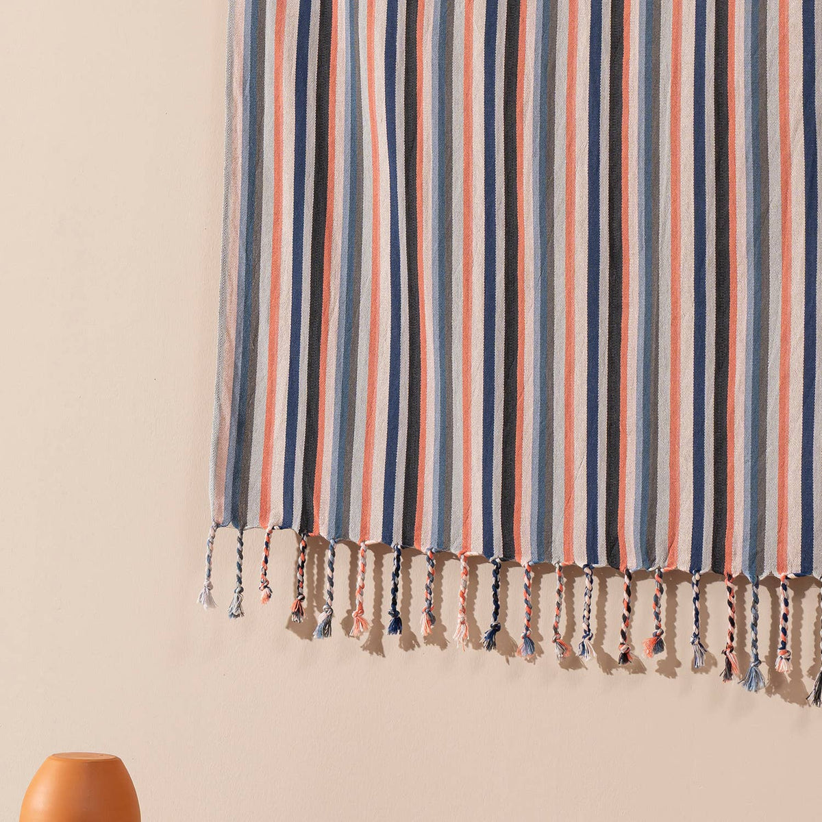 Fringed hem of the terracotta and blue stripe Turkish peshtemal | Kikoya