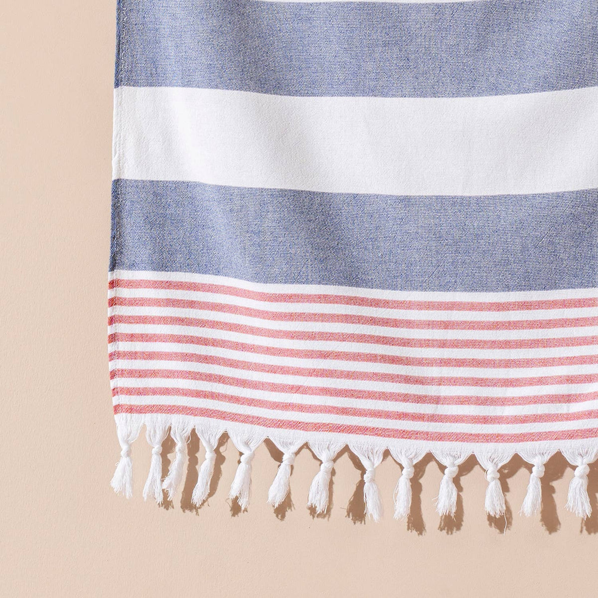 Navy and white block stripe terry-backed Turkish towel with red tassels | Kikoya
