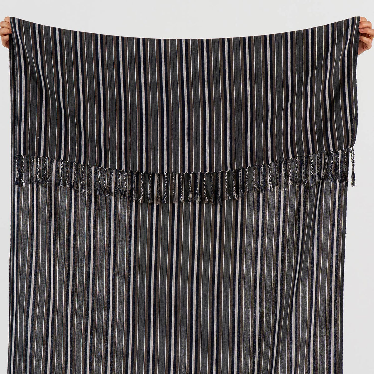 Hand-knotted fringe detail on the graphite pinstripe Turkish towel | Kikoya
