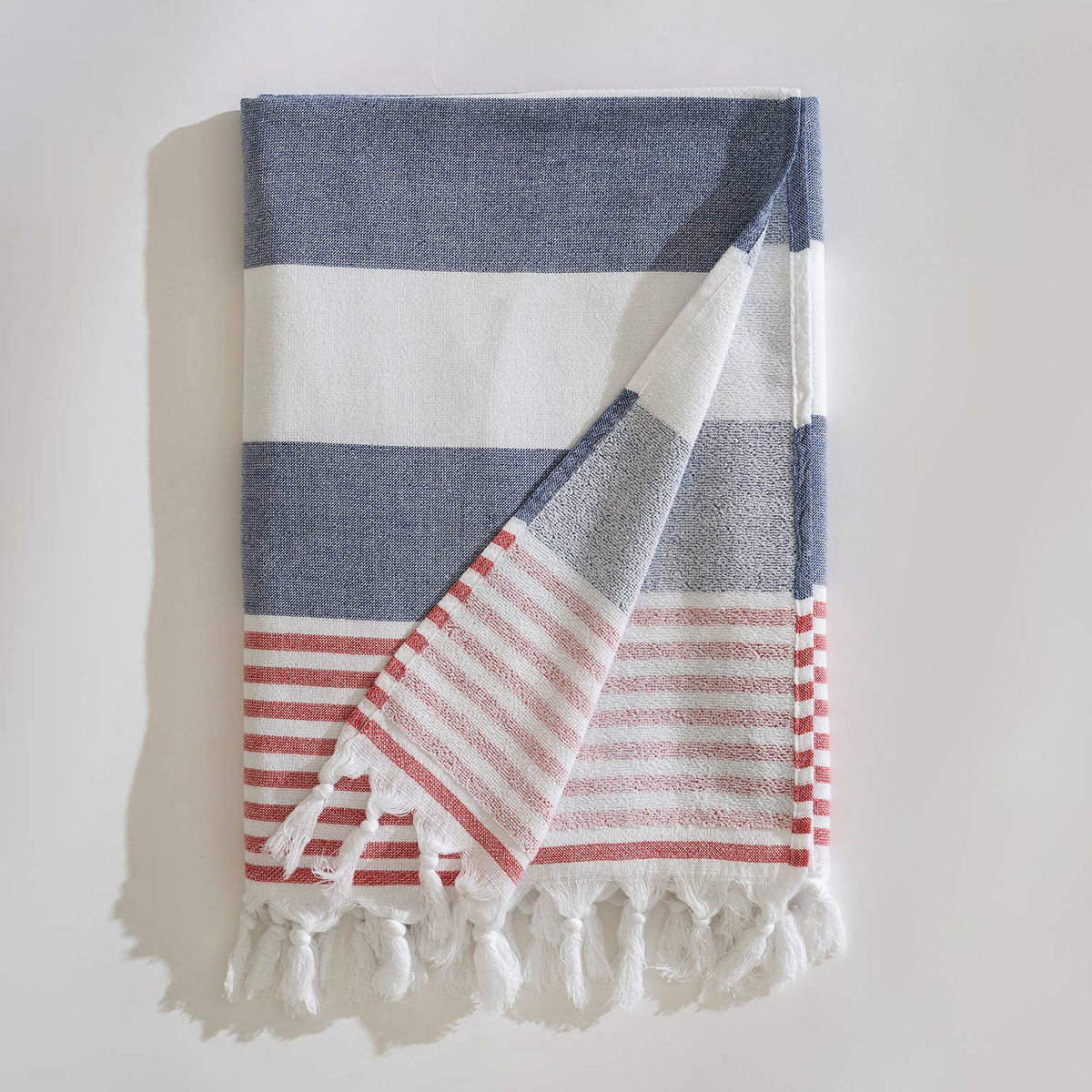 Navy and white block stripe terry-backed Turkish towel with red tassels | Kikoya