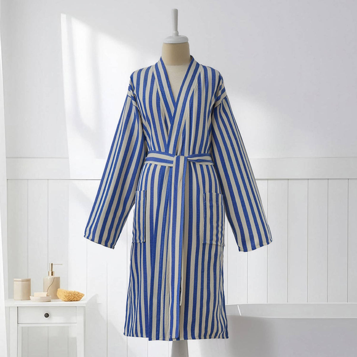 Blue and cream zebra stripe Turkish bathrobe on a mannequin, full length | Kikoya