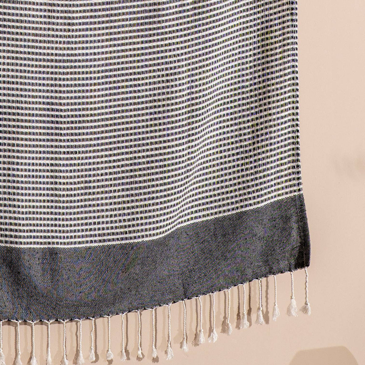 Knotted fringe detail on the black Efes Turkish towel | Kikoya