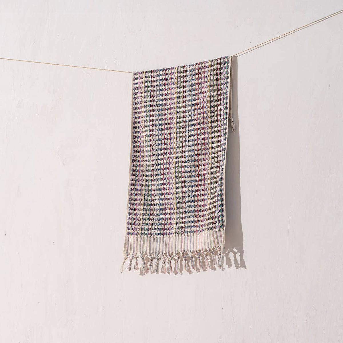 Handloomed Turkish hand towel with multicolour pompoms, 17x38 in | Kikoya