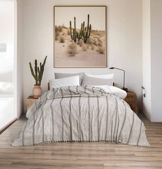 Melange stripe Turkish cotton bedspread – grey on cream, styled on a bed | Kikoya