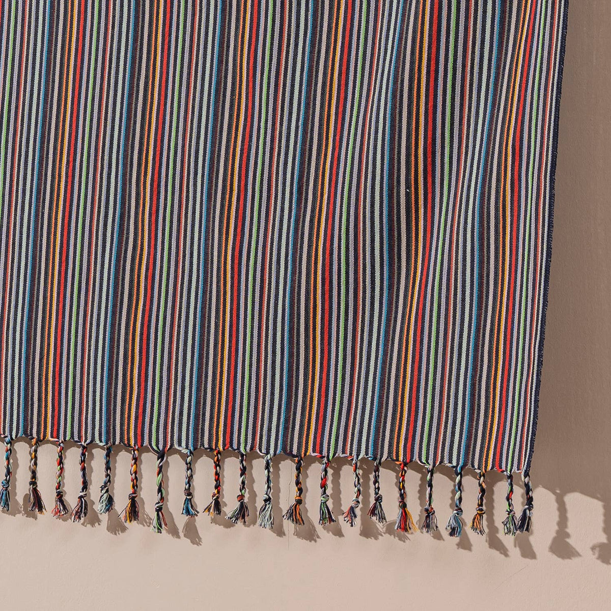 Premium rustic Turkish beach towel in fine multicolour stripes on slate | Kikoya