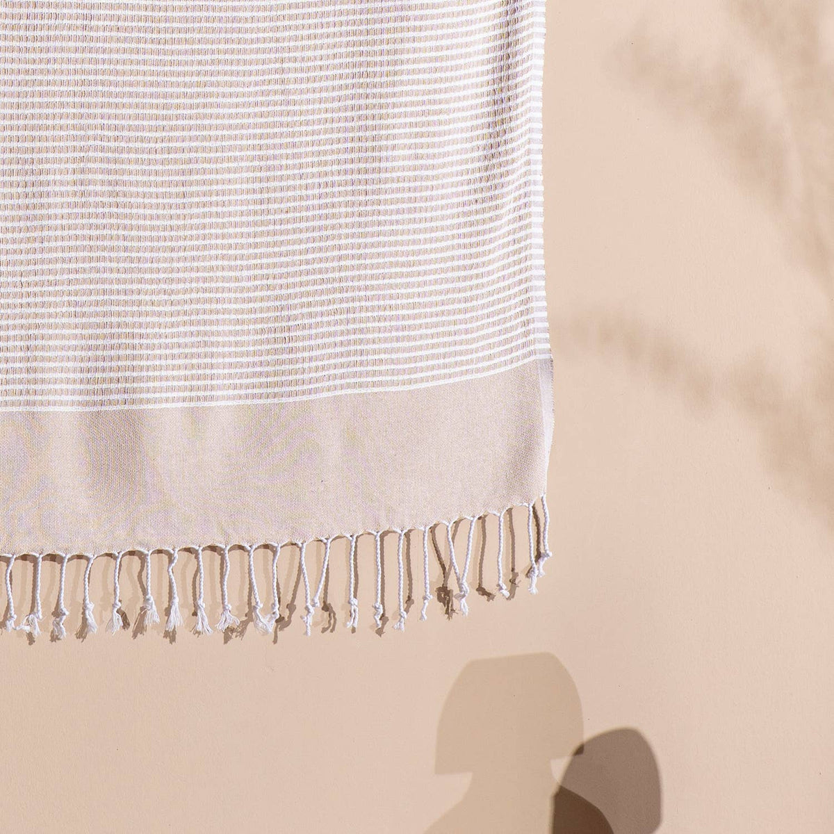 Fringed hem of the beige Efes Turkish peshtemal | Kikoya