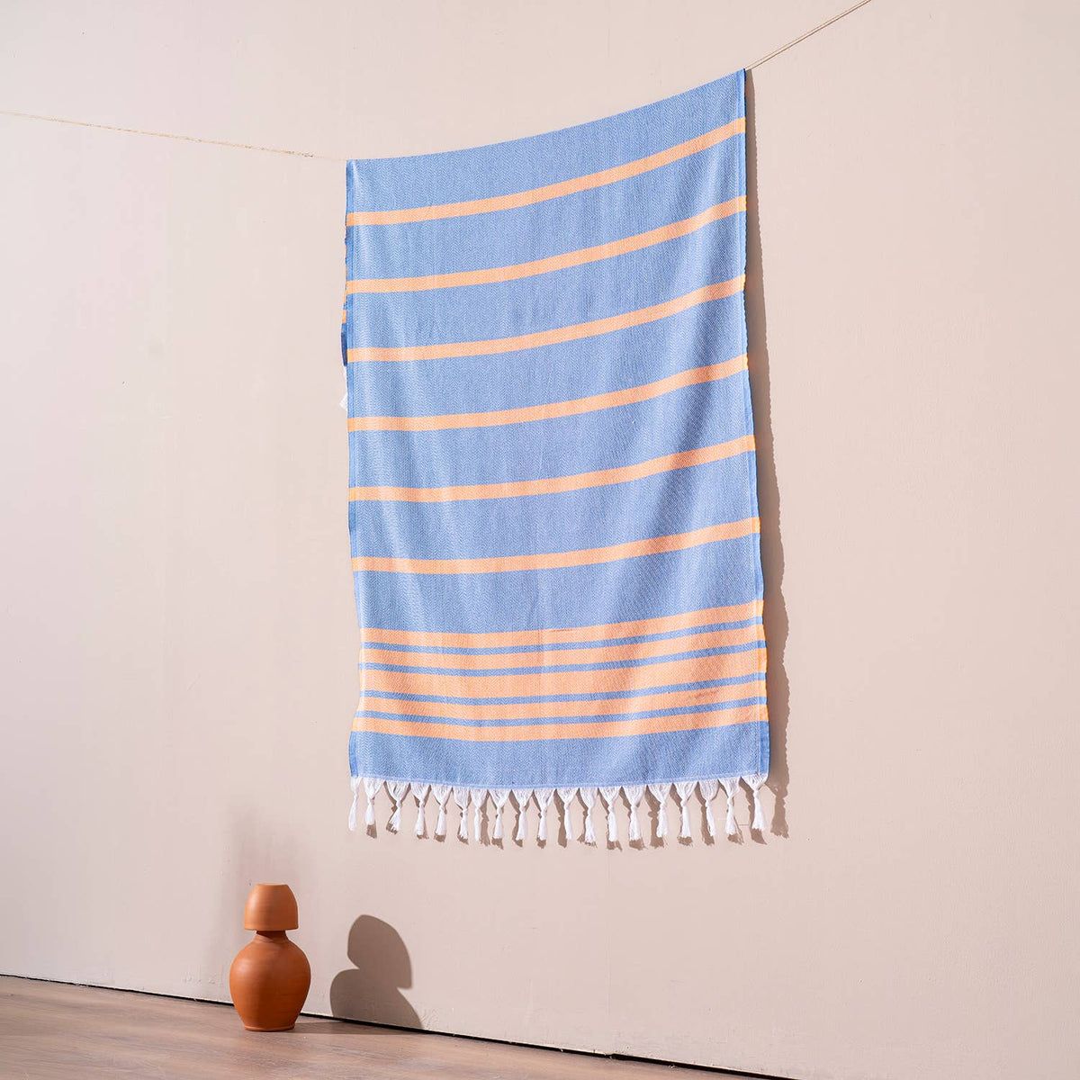 Luxe Herringbone Turkish towel – Blue/Orange, blue with orange stripes, hanging | Kikoya