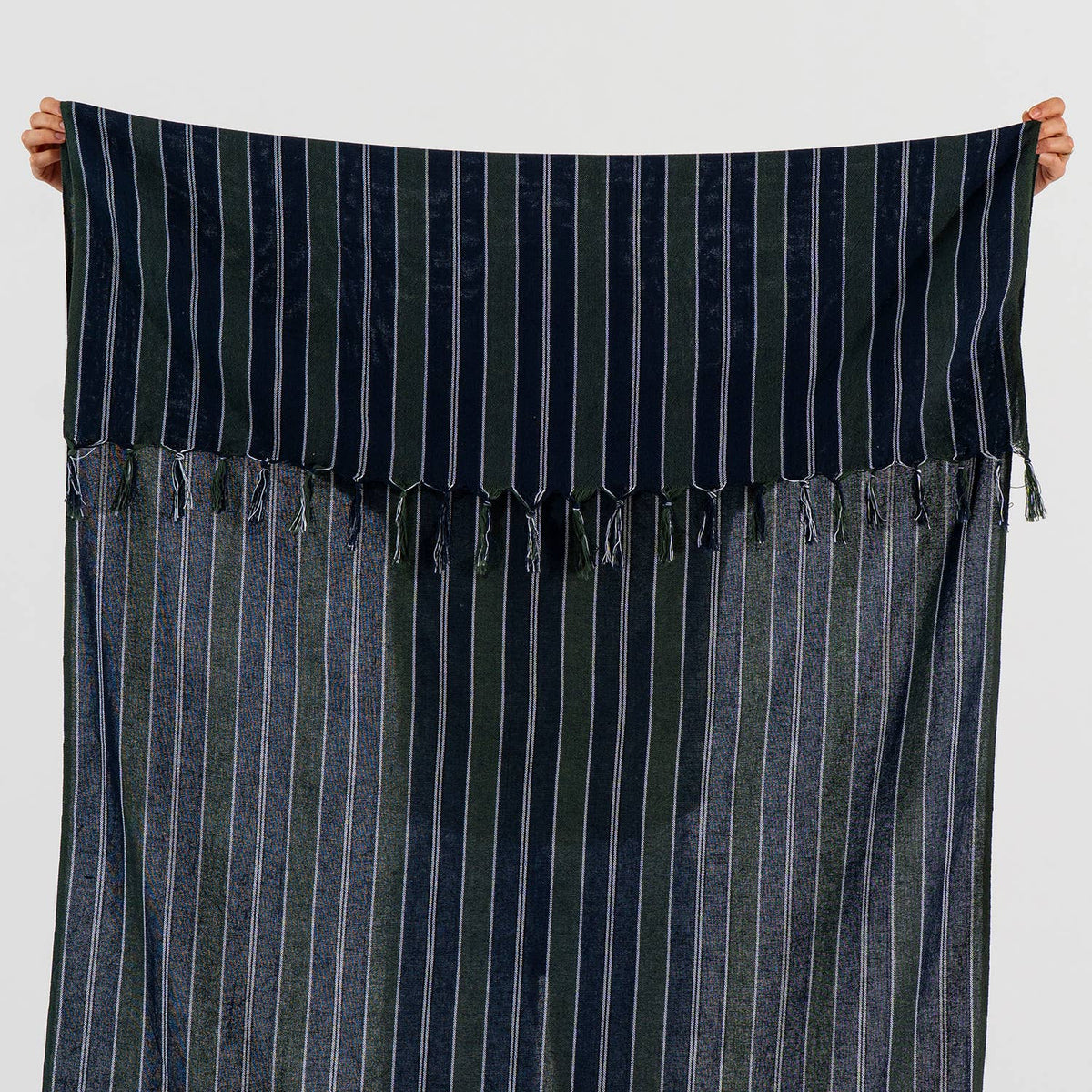 Ink navy Turkish towel held open to show its full width and pinstripes | Kikoya