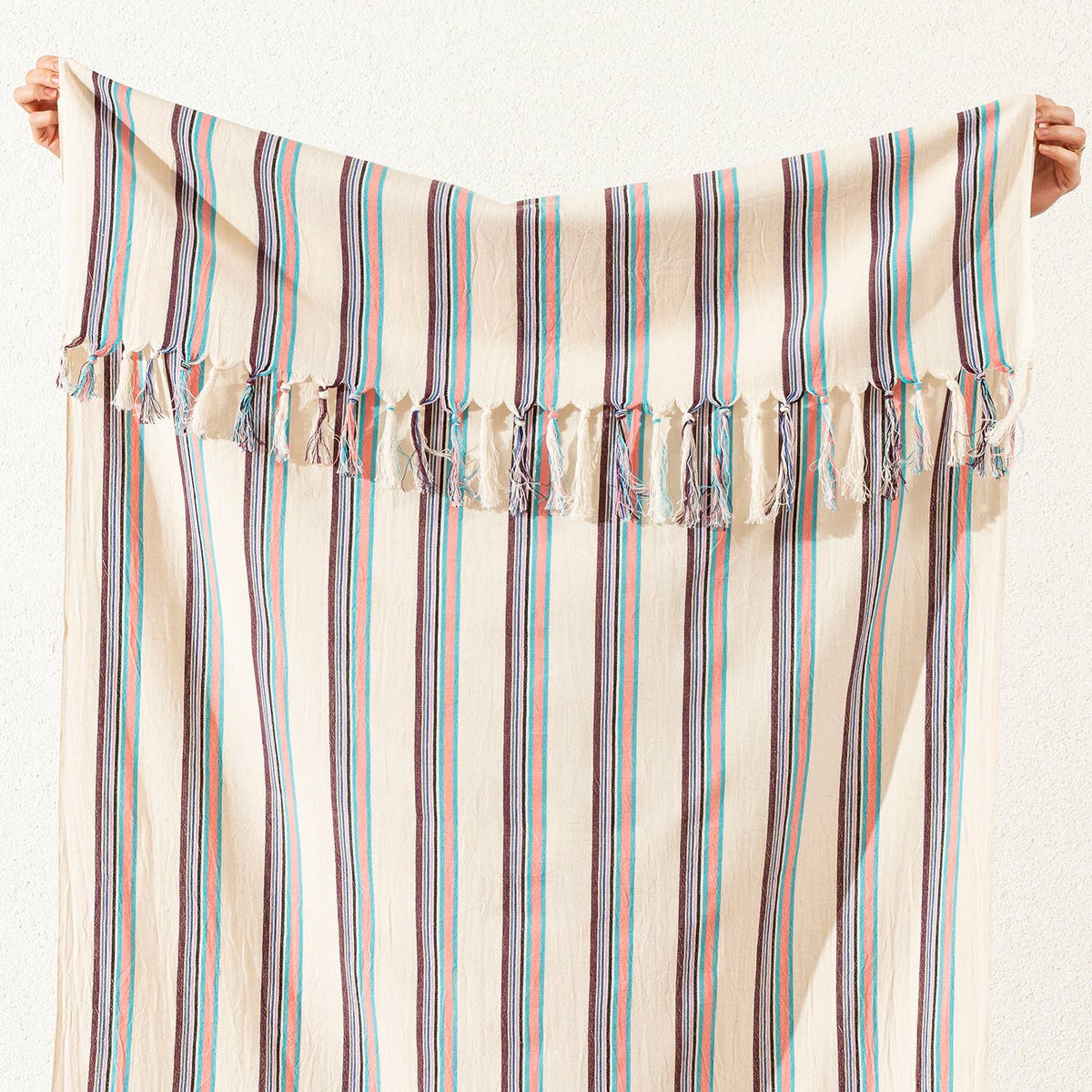 Hand-knotted fringe detail on the teal and plum pinstripe Turkish towel | Kikoya