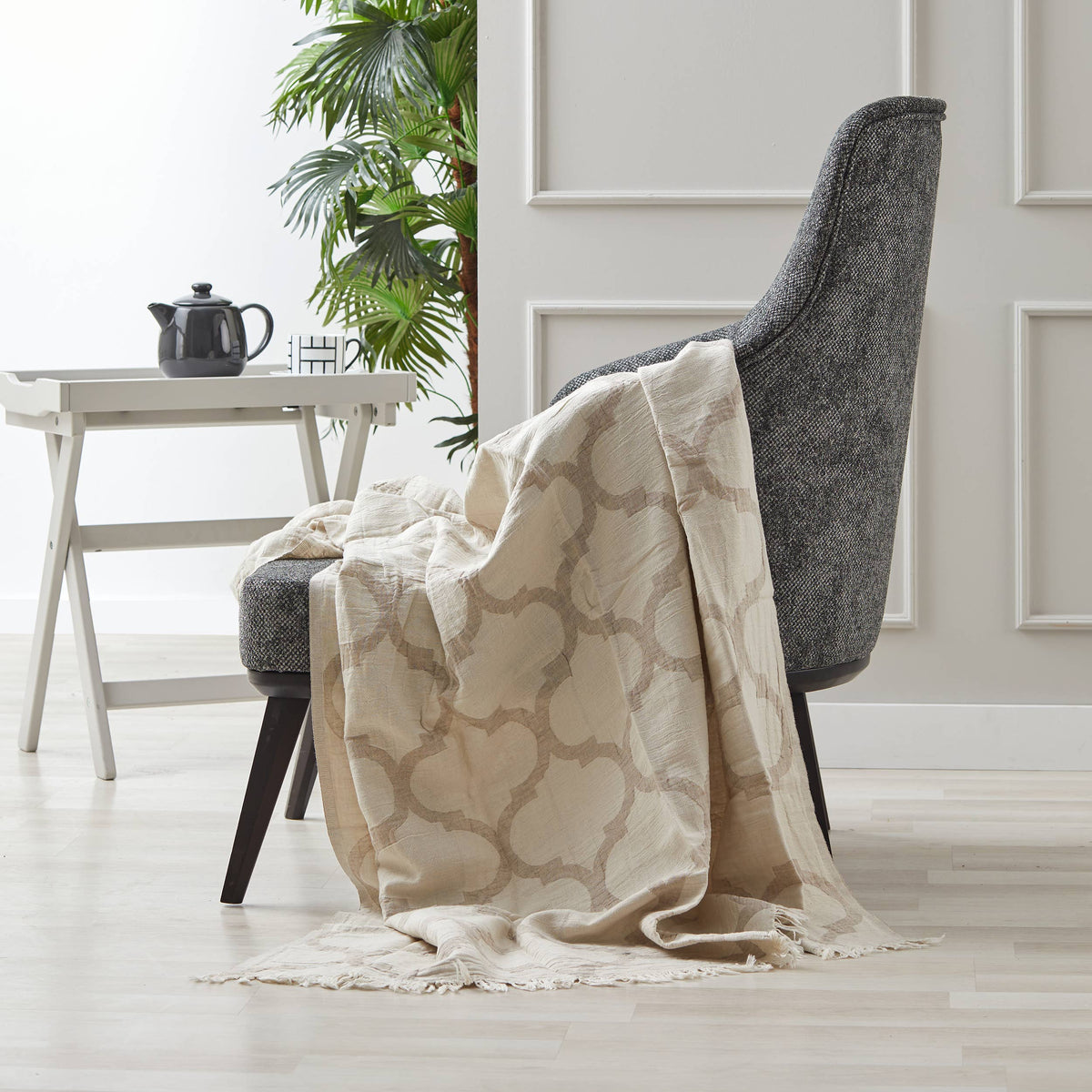 Trellis linen cotton Turkish throw – quatrefoil, Beige, draped over a chair | Kikoya