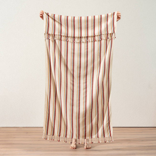 Linen-look Turkish peshtemal in multicolour pinstripes on cream, held open | Kikoya