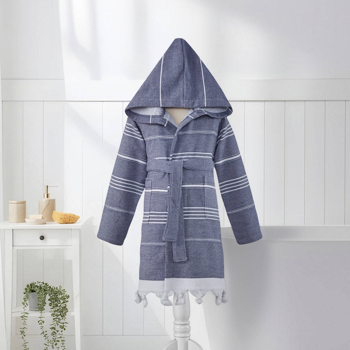 Navy stripe kids Turkish bathrobe shown full length with belt tied and tasselled hem | Kikoya