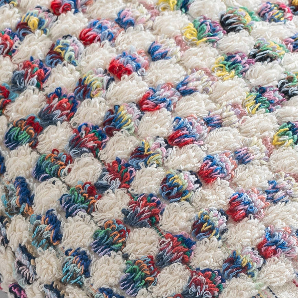 Handloomed Turkish hand towel with multicolour pompoms, 17x38 in | Kikoya