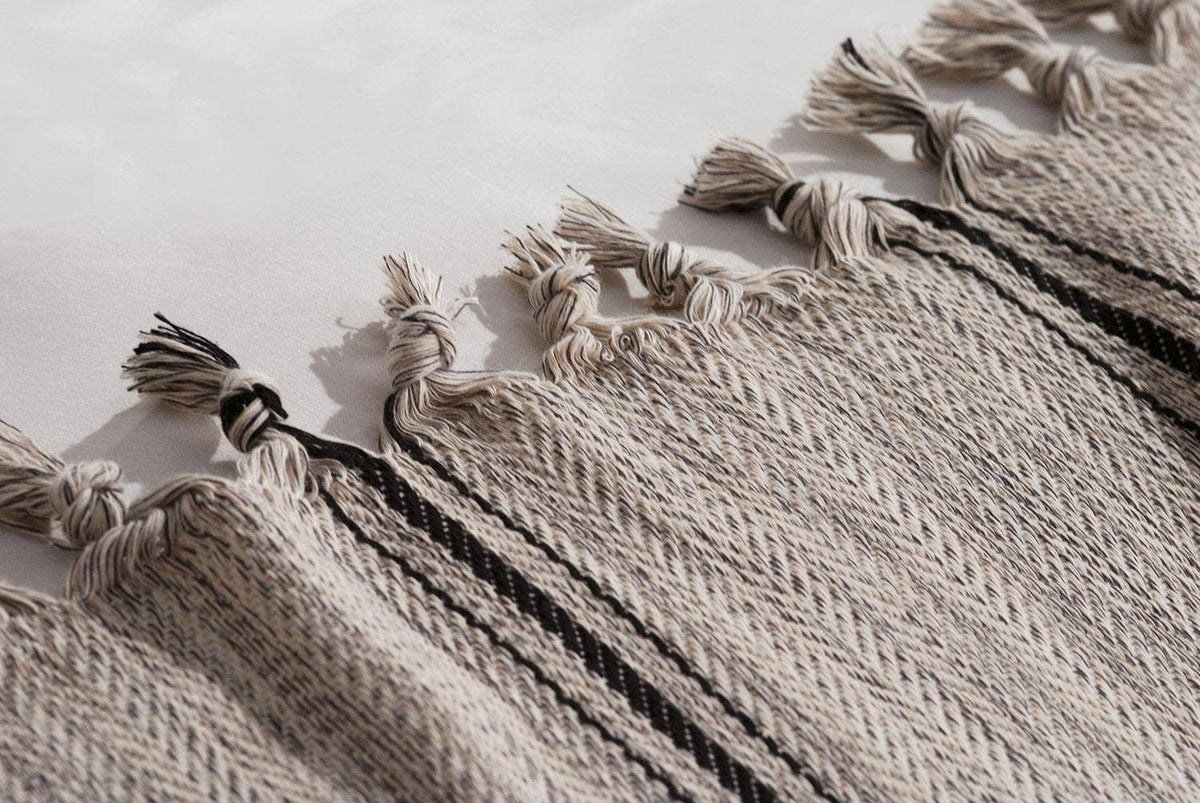 Melange stripe Turkish cotton bedspread – grey on cream, weave and tassel detail | Kikoya