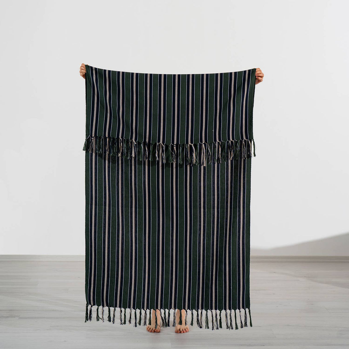 Premium Rustic Turkish beach towel in forest green with navy and cream pinstripes, held open, 40x70 in | Kikoya