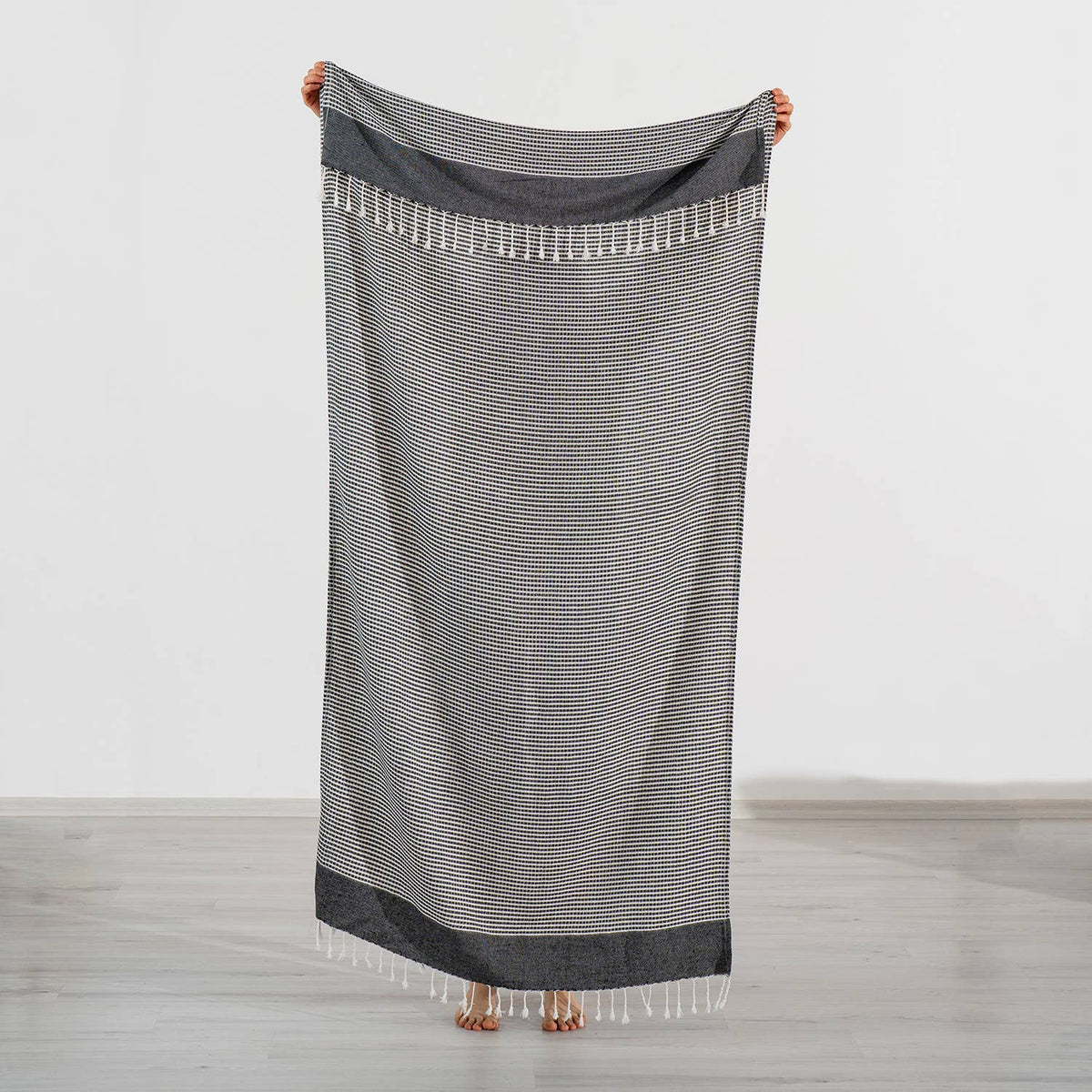 Efes Turkish beach towel in black fine stripe with knotted fringe | Kikoya