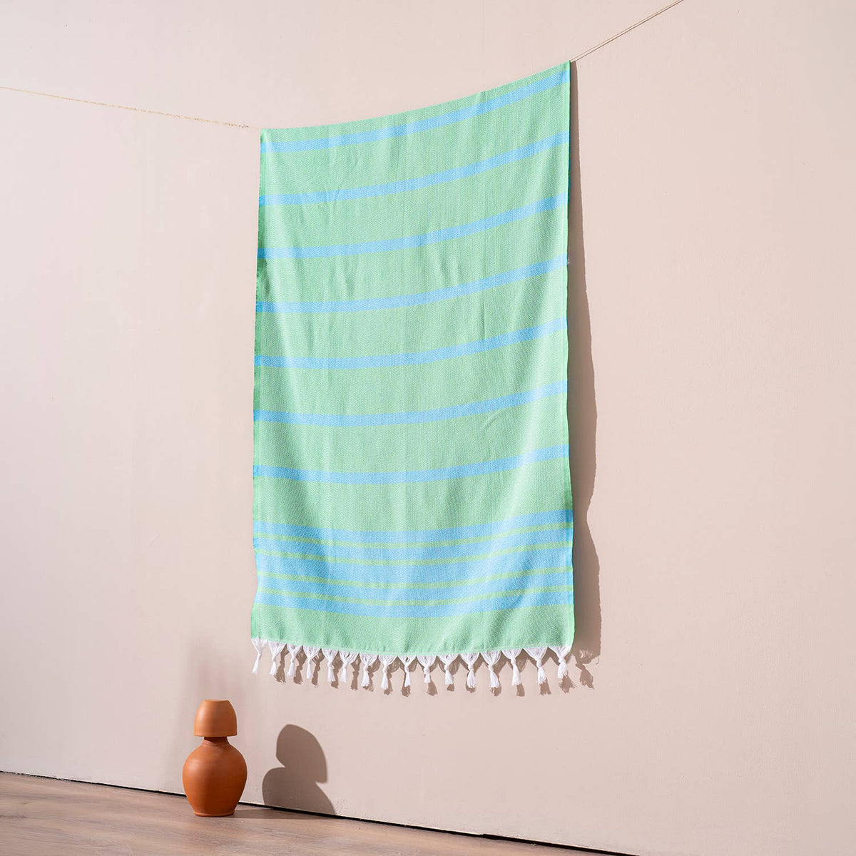 Luxe Herringbone Turkish towel – Green/Turquoise, green with turquoise stripes, hanging | Kikoya