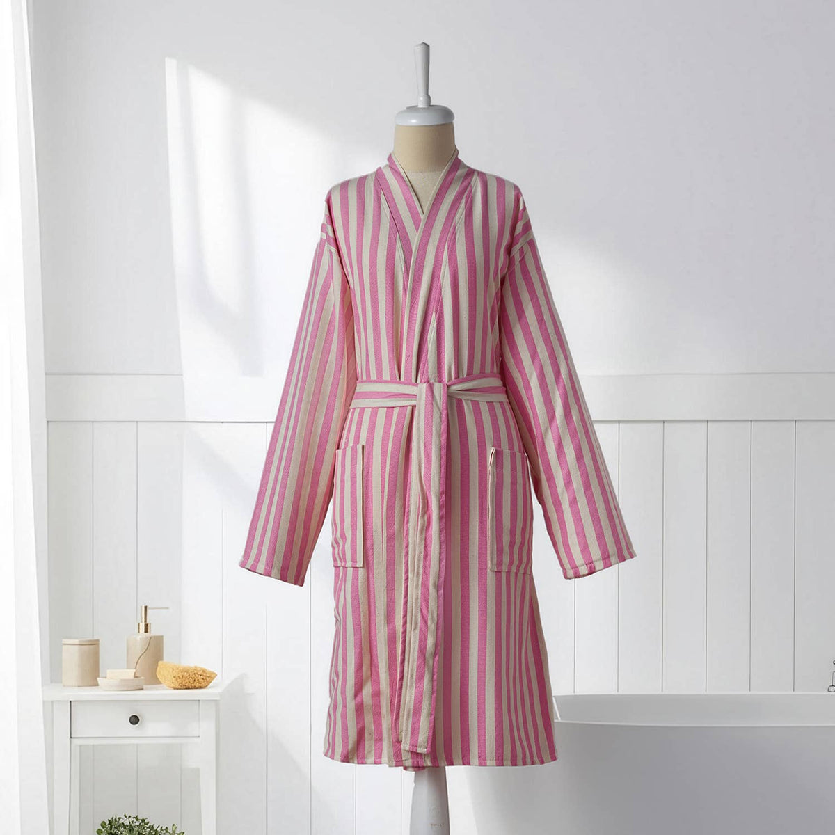 Pink and cream zebra stripe Turkish bathrobe on a mannequin, full length | Kikoya