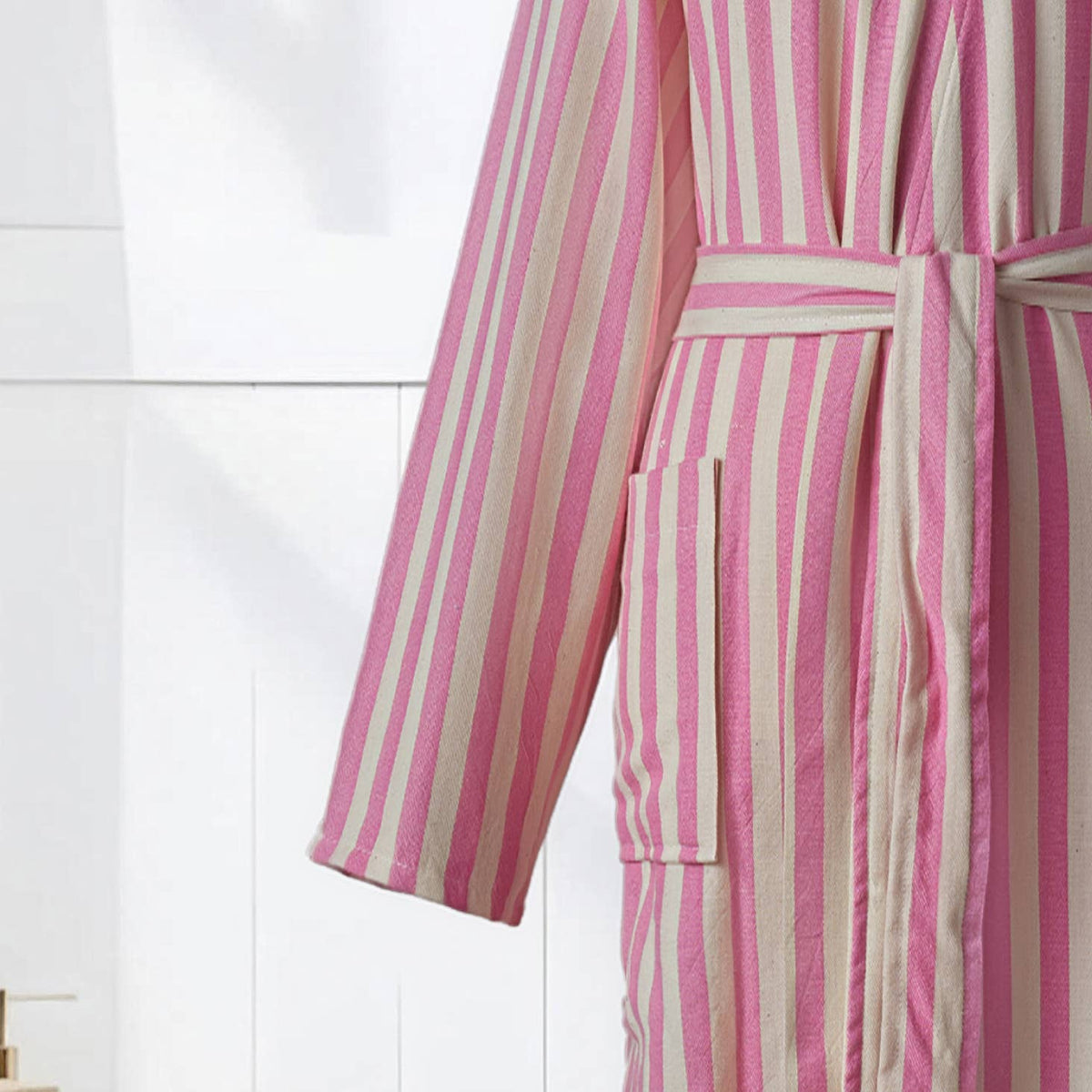 Patch pocket and self belt detail on the pink zebra stripe bathrobe | Kikoya