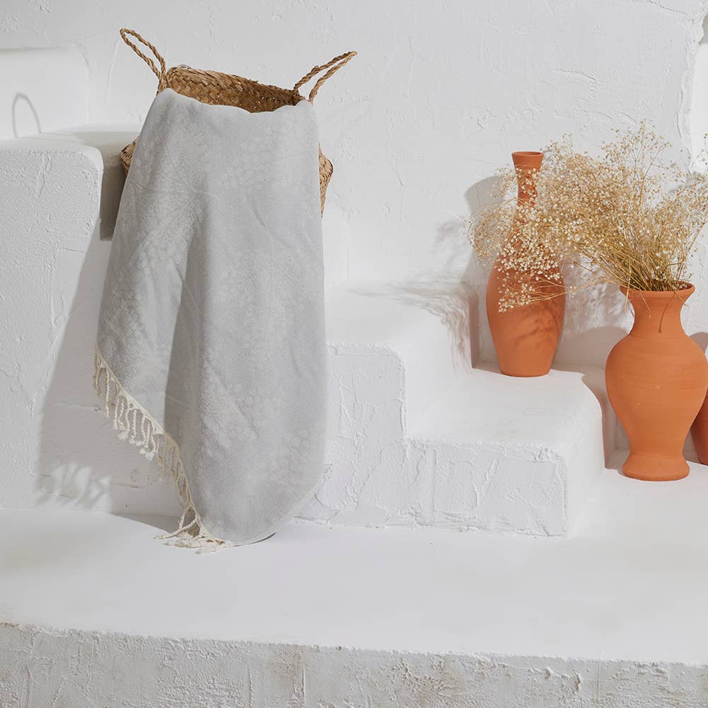 Leaves terry-backed Turkish towel with tonal leaf jacquard in grey | Kikoya