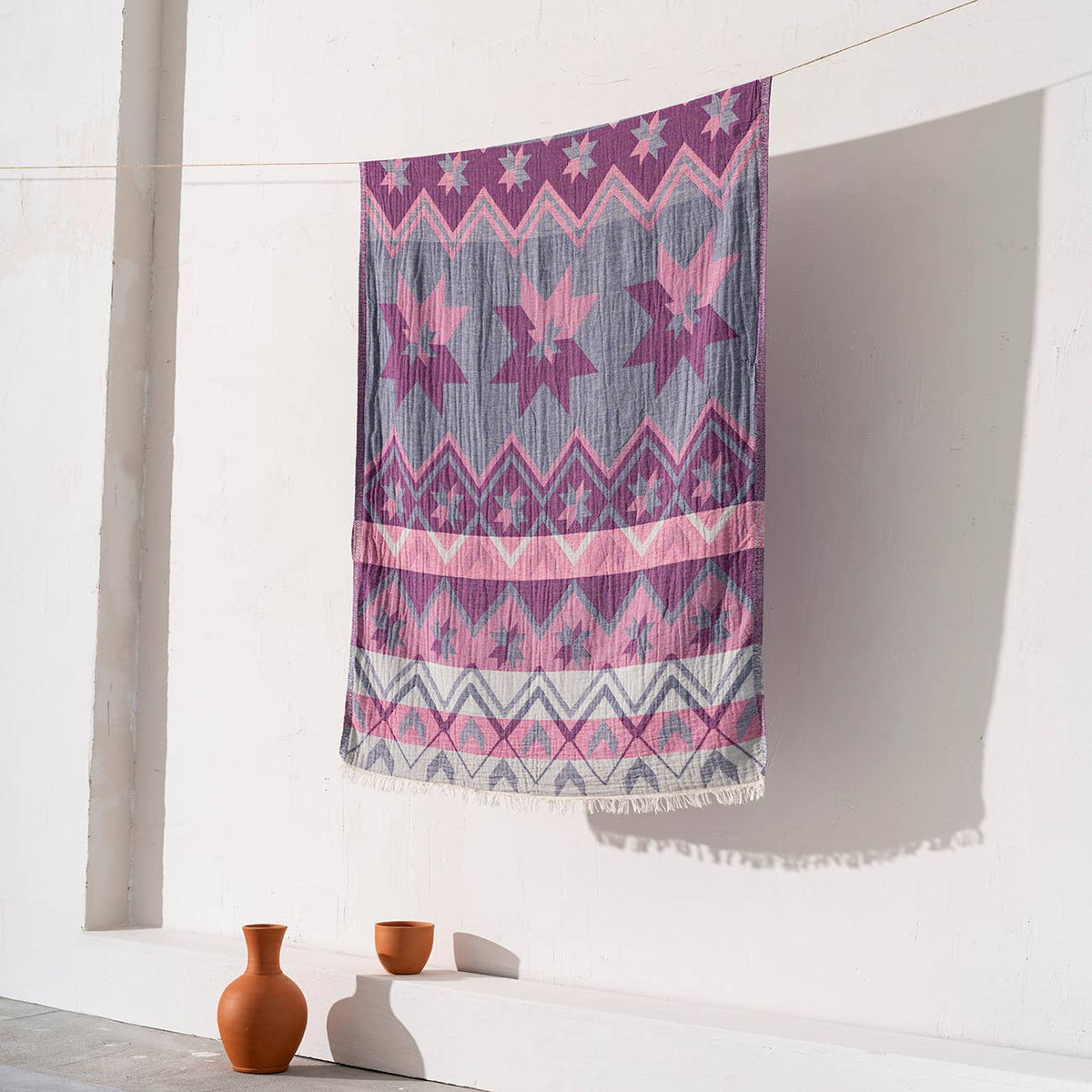 Ethnic print Turkish beach towel in pink and purple, 33x66 in | Kikoya