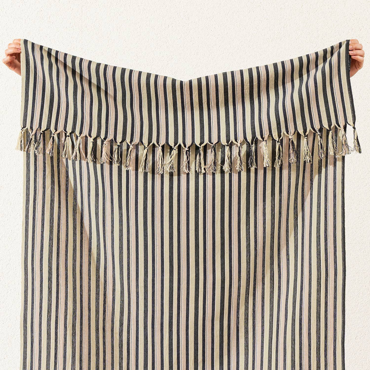 Hand-knotted fringe detail on the charcoal ticking stripe Turkish towel | Kikoya