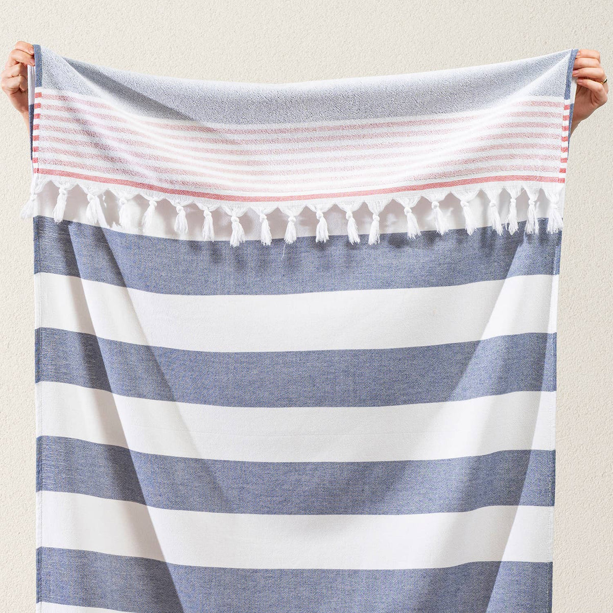 Navy and white block stripe terry-backed Turkish towel with red tassels | Kikoya