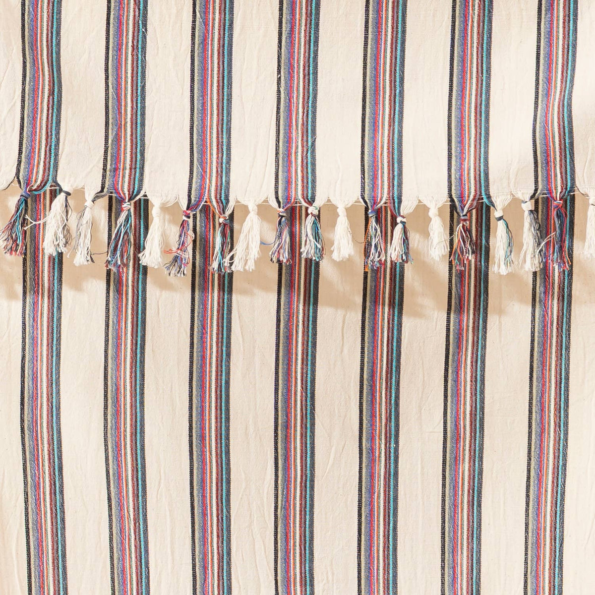 Close-up of the rustic flat weave and rose pinstripes on natural cream cotton | Kikoya