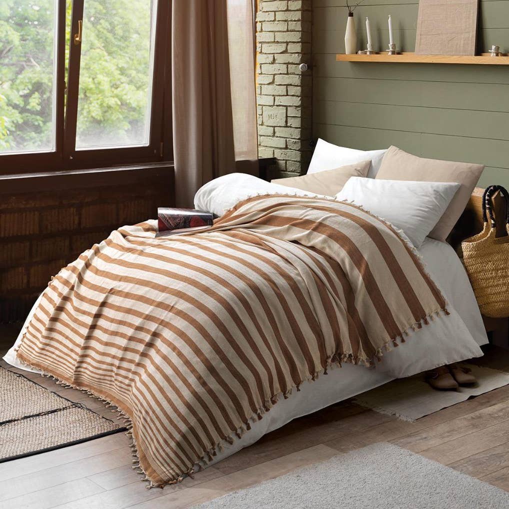 Cizgi Turkish cotton bedspread – Block Stripe, Caramel, styled on a bed | Kikoya