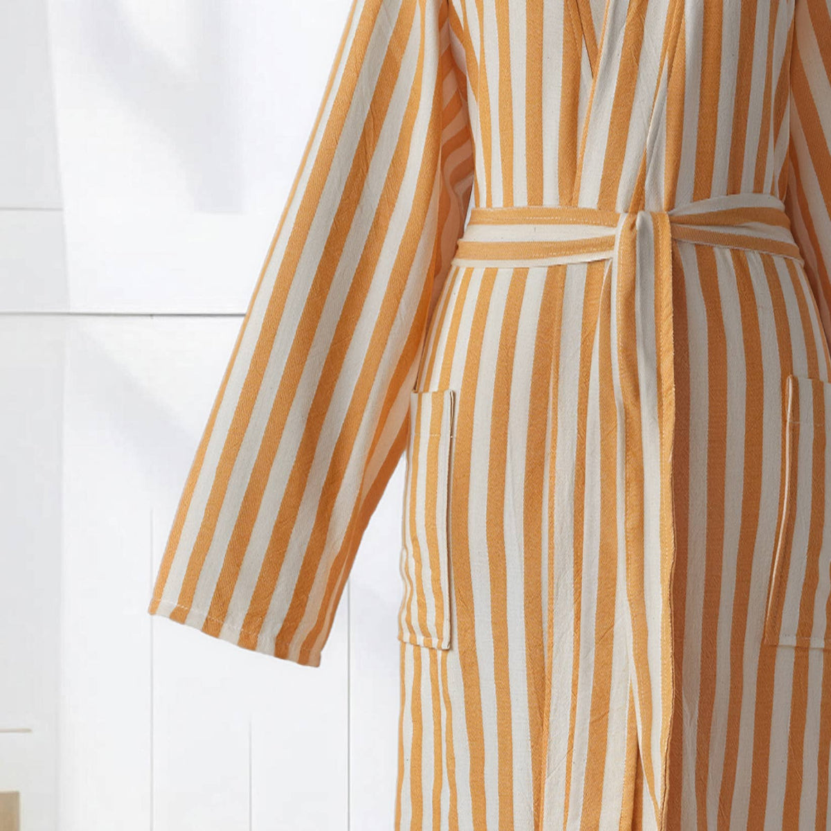 Sleeve and self belt detail on the yellow zebra stripe bathrobe | Kikoya