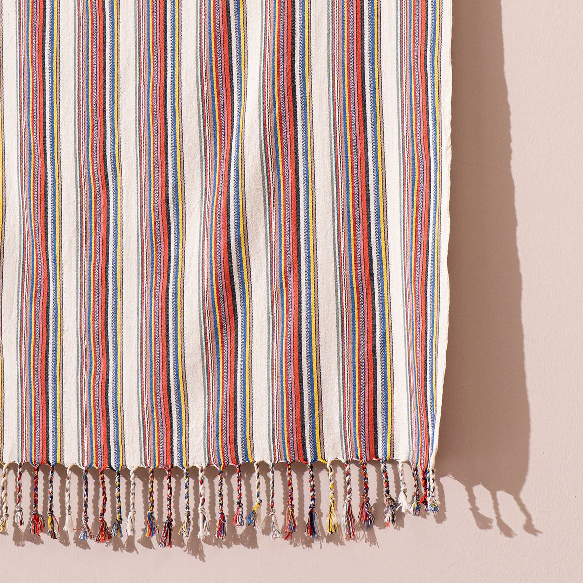 Bazaar stripe Turkish towel draped in sunlight showing its full length | Kikoya