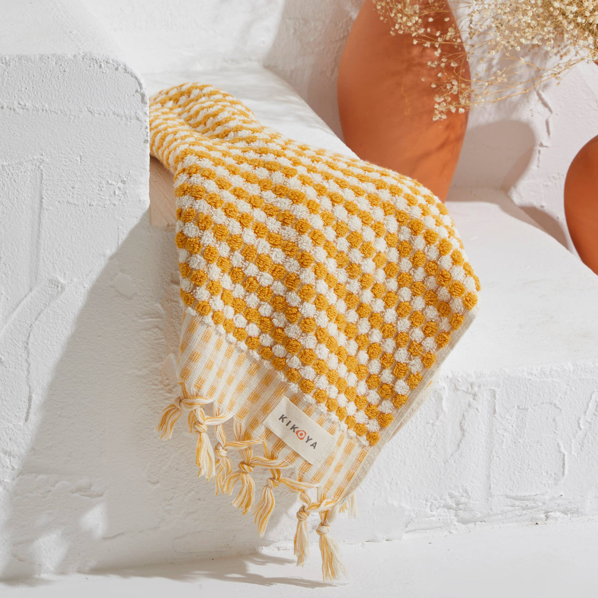 Pompom handloomed Turkish hand towel, 17x38 in, raised bubble weave with pompom fringe | Kikoya